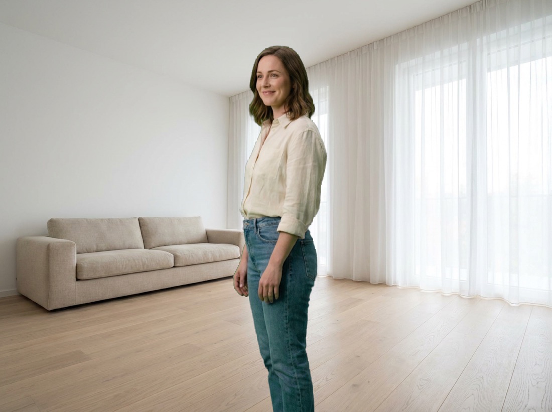 The same woman, with the green backdrop removed, standing in a sunlit living room.